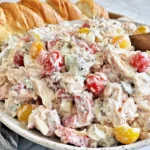 Italian Grinder Chicken Salad with rotisserie chicken, salami, pepperoni, tomatoes, and creamy dressing served with crusty bread
