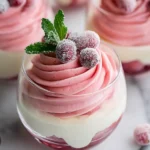Cranberry Mousse Cups with layered pink cranberry mousse, vanilla cream, sugared cranberries, and fresh mint