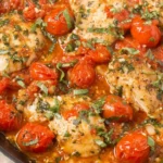 Healthy Chicken Pomodoro Skillet with seared chicken breasts simmered in juicy grape tomatoes, garlic, and fresh basil in a single pan.
