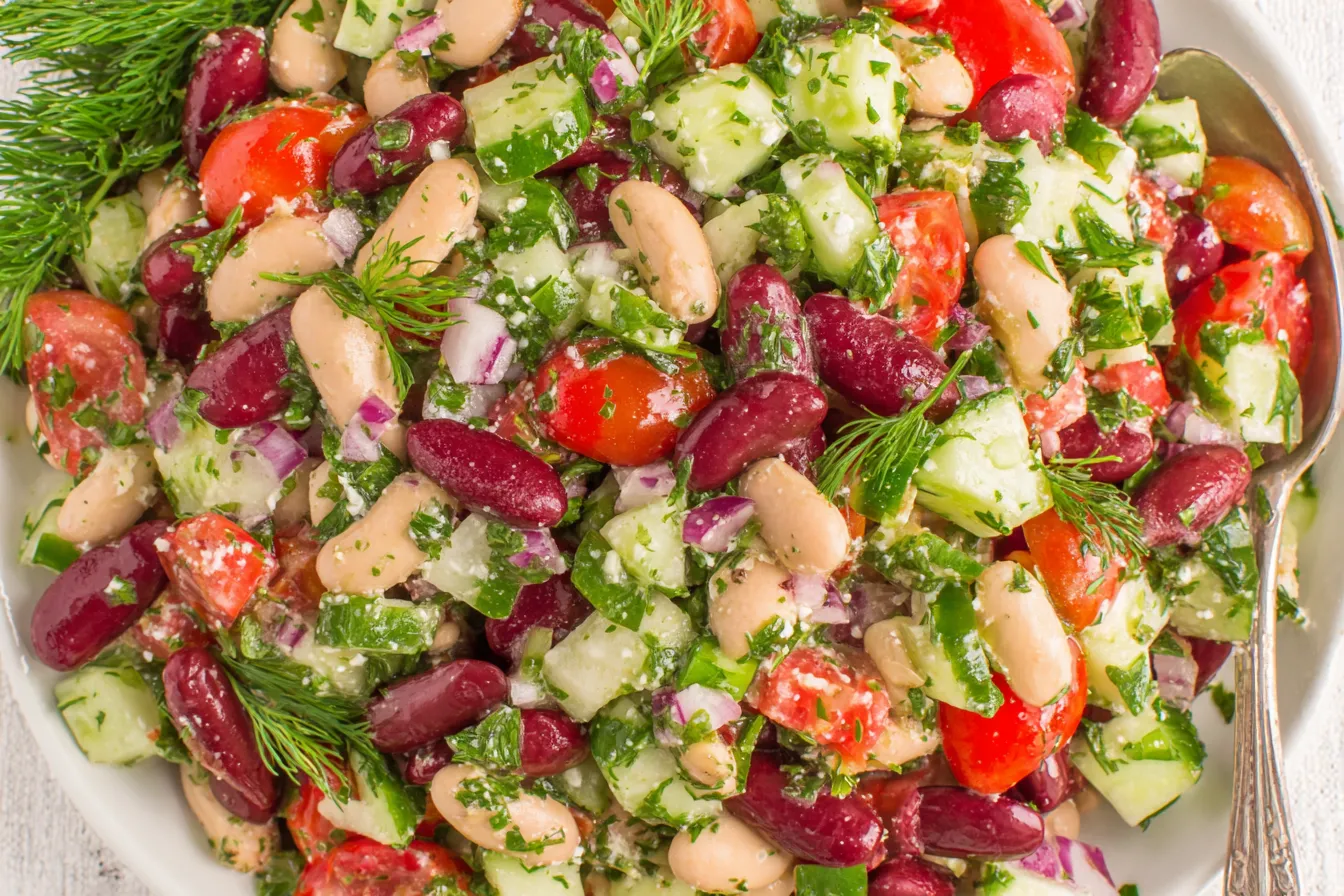 Mediterranean Bean Salad Recipe with kidney beans, white beans, cucumber, tomatoes, and fresh herbs tossed in a lemon olive oil dressing