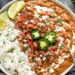 Pinto Beans Recipe served with white rice, jalapeños, and fresh toppings in a bowl