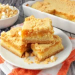 Banana Blondies soft and chewy bars with vanilla wafer crust and white chocolate chips on a plate