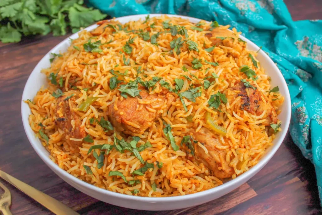 Chicken Biryani garnished with fresh cilantro in a serving bowl