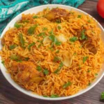 Chicken Biryani served in a white bowl with fragrant basmati rice and tender chicken