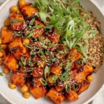 Gochujang Potatoes and Chickpeas bowl with crispy roasted Yukon gold potatoes, chickpeas, quinoa, scallions, and sesame seeds