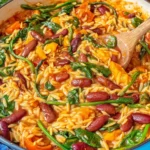 Creamy Mediterranean Orzo and Beans simmered in a tomato broth with kidney beans, spinach, and tender orzo in a one-pot skillet.