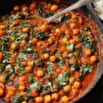 One-Pan Harissa Chickpeas Recipe served in a skillet with rice on the side