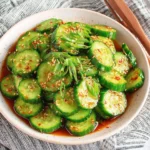 Asian Cucumber Salad TikTok Recipe with sliced cucumbers in spicy sesame soy marinade
