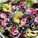 Blueberry and Pistachio Spring Salad with avocado, feta, and pomegranate