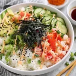 California Roll Sushi Bowls with imitation crab, avocado, cucumber, sushi rice, nori and spicy mayo drizzle