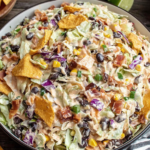Frito Cowboy Cabbage with bacon black beans and crunchy Fritos in creamy dressing