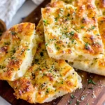 Garlic Parmesan Focaccia Bread sliced showing soft fluffy interior