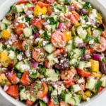 Mediterranean Chopped Salad with cucumbers, tomatoes, olives, and feta cheese in a bowl