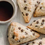 Chocolate Chip Sourdough Scones served with coffee showing golden crumbly texture