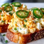 Crispy Egg Salad served on toasted bread with jalapeños and chives