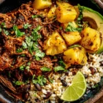 Crockpot Chipotle Pineapple Pot Roast Bowl with shredded beef, pineapple, rice, and avocado