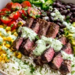 Easy cilantro lime steak bowls with rice, avocado, corn, and creamy sauce