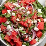 Fresh feta watermelon salad with arugula, red onion, and mint