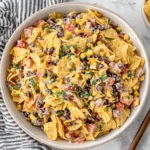 Frito Corn Salad with corn, black beans, cheese, and crunchy chips in a creamy dressing