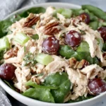 Healthy Chicken Salad with Grapes served over fresh greens with pecans