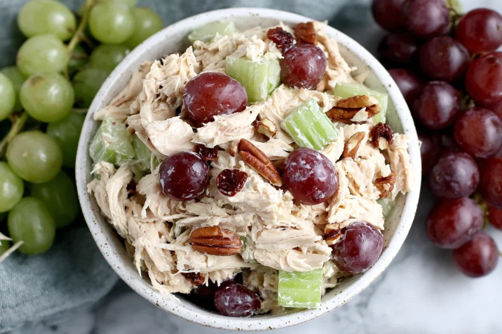 Healthy Chicken Salad with Grapes in a bowl with pecans and celery