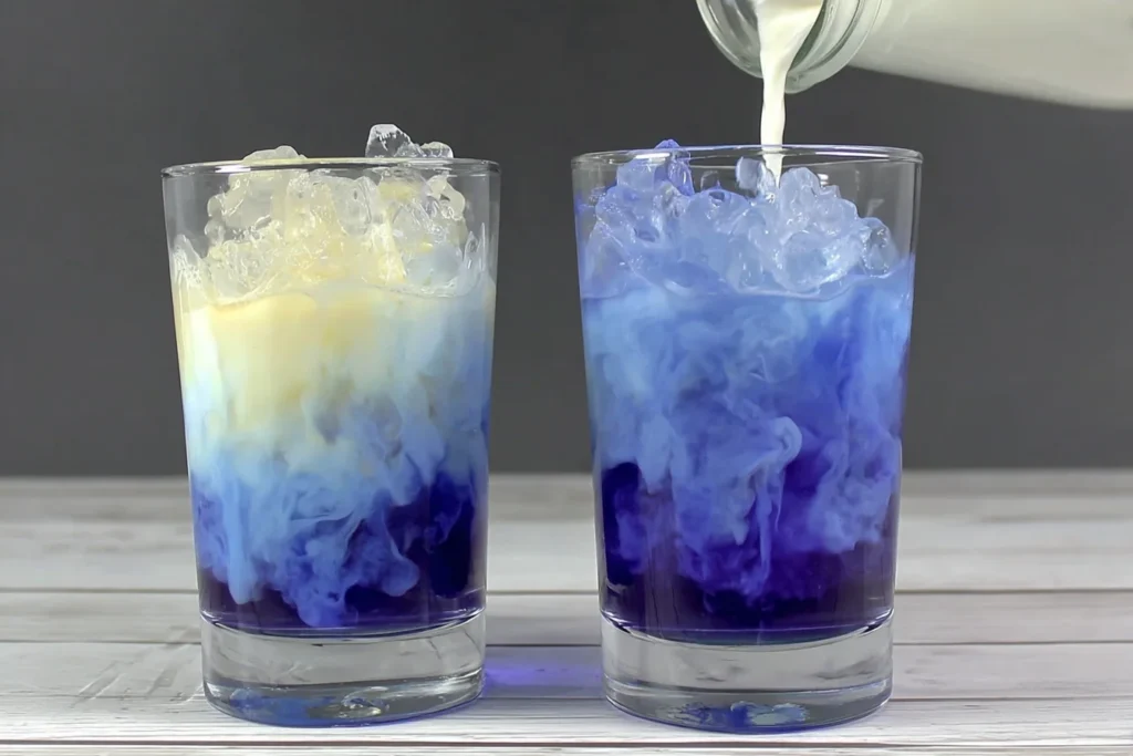 Iced Blue Tea Latte Recipe with milk being poured over vibrant butterfly pea tea and ice