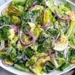 Lemon Parmesan Lettuce Salad tossed with lemon zest, parmesan, and red pepper flakes