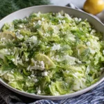 Maroulosalata (Greek Lettuce Salad) topped with feta, dill, and lemon slices