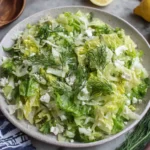 Maroulosalata (Greek Lettuce Salad) with feta, dill, and lemon dressing in a bowl