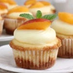 Peach & Honey Cheesecake Cupcakes with creamy filling and graham crust topped with peach slices