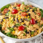 Quick Southwest Chicken Salad Recipe served in a bowl with lettuce, black beans, corn, and cherry tomatoes