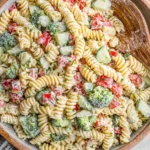 Ranch Pasta Salad tossed with fresh vegetables and creamy dressing in a serving bowl