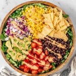 Fresh Southwest Salad with avocado, corn, black beans, tomatoes, and tortilla chips