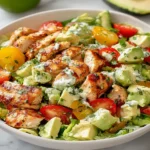 Avocado Chicken Salad Recipe with grilled chicken, avocado, cherry tomatoes, and creamy lime dressing in a fresh salad bowl