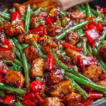 Chicken Green Bean Stir Fry with crispy chicken thighs and fresh green beans in sweet chili glaze