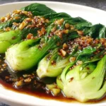 Easy Bok Choy With Garlic Soy Sauce served on a white platter with tender bok choy and savory garlic soy glaze