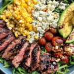 Grilled Balsamic Steak Salad Recipe with sliced steak, grilled corn, avocado, and Gorgonzola cheese