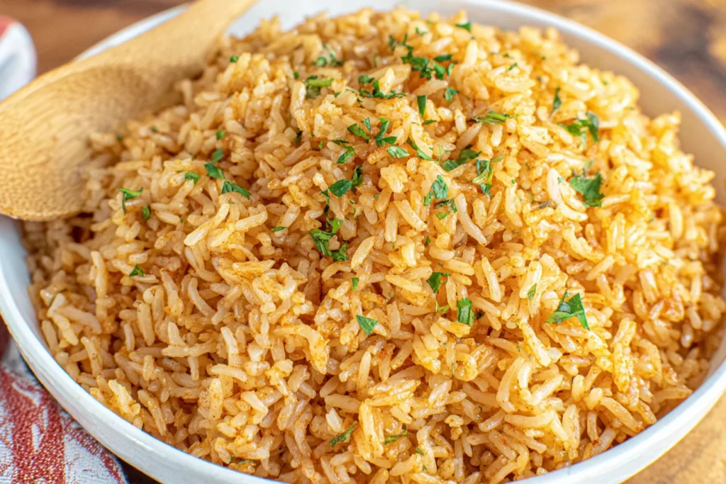 Texas Roadhouse Seasoned Rice in serving bowl with parsley topping