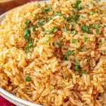 Close-up of Texas Roadhouse Seasoned Rice with herbs and savory spices