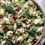 Apple Broccoli Cauliflower Salad served with apples, cranberries, feta, and roasted almonds