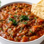 Blender Salsa Recipe served in a bowl with tortilla chips, fresh cilantro, and a chunky restaurant-style texture