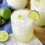 Brazilian Lemonade served over ice with fresh lime slices and a creamy citrus finish