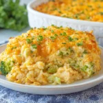 Chicken Broccoli Rice Casserole served on a plate with melted cheddar cheese, tender chicken, broccoli, and creamy rice