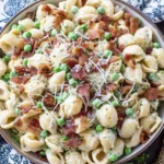Creamy Pasta Salad Recipe served with bacon, green peas, parmesan, and creamy shell pasta for a classic summer side dish