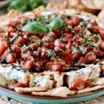 Easy Bruschetta Dip Recipe made with herbed cheese, fresh tomatoes, basil, and balsamic glaze served with crackers.