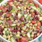 Easy Fresh Mediterranean Bean Salad made with three beans, cucumber, tomatoes, red onion, and Mediterranean herbs
