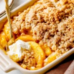 Easy Peach Cobbler served warm with vanilla ice cream, juicy peaches, and a buttery cinnamon crumble topping