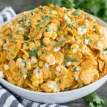 Fritos Corn Salad Recipe with creamy corn, crunchy chili cheese Fritos, and fresh cilantro in a serving bowl