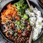 Korean Lentils Vegan Bulgogi Recipe served with rice, shiitake mushrooms, broccoli, kimchi, green onions, and sesame seeds