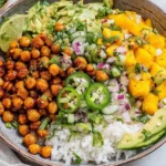 Mango Chickpea Salad Recipe with roasted chickpeas, mango salsa, avocado, cucumber, jalapeño, and rice